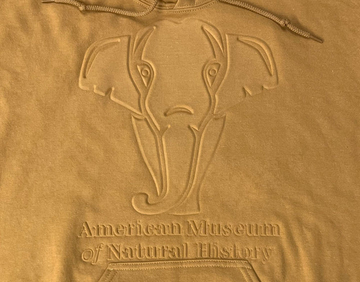Adult AMNH Gold Embossed Elephant Hoodie closeup